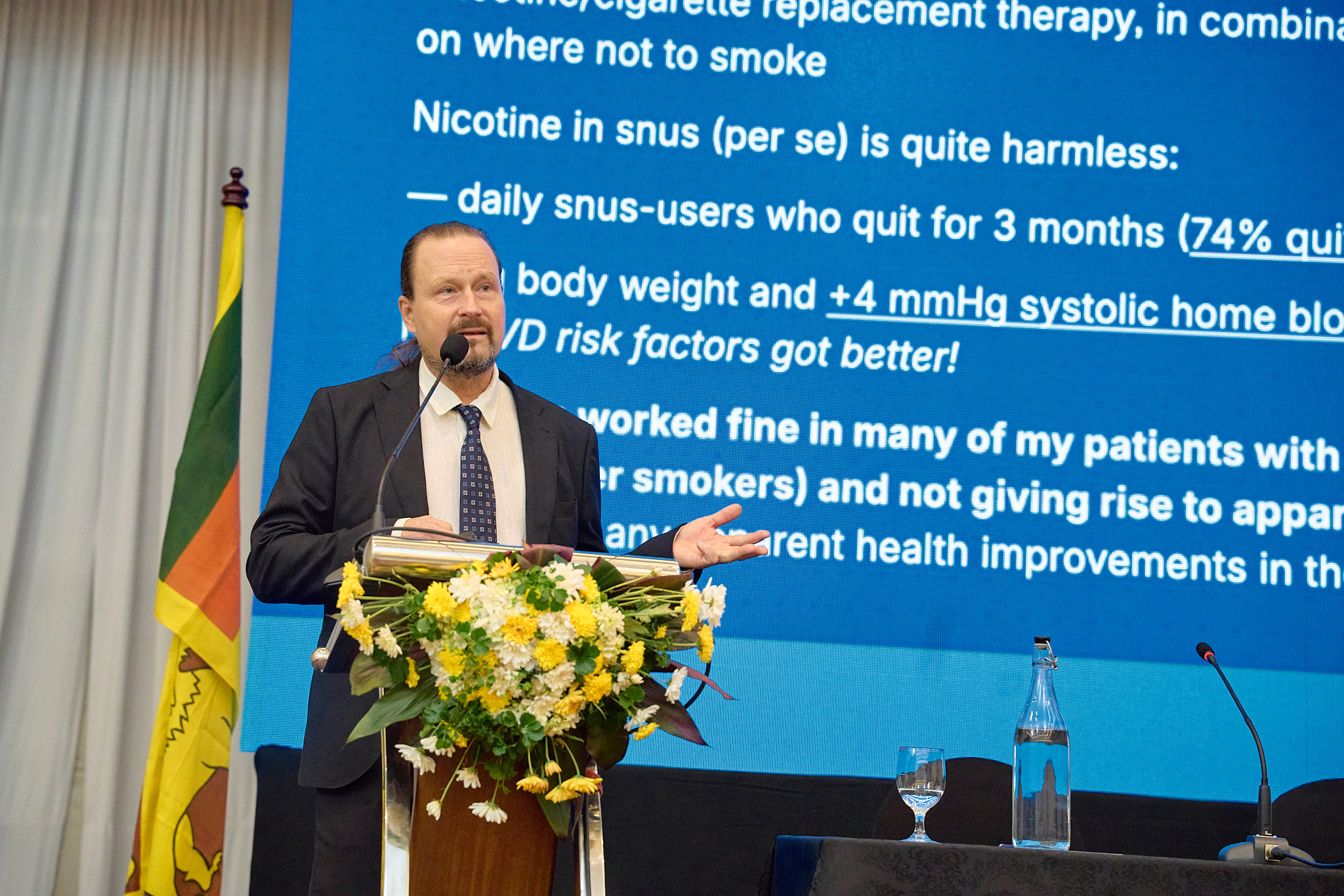 Speaker presenting at podium